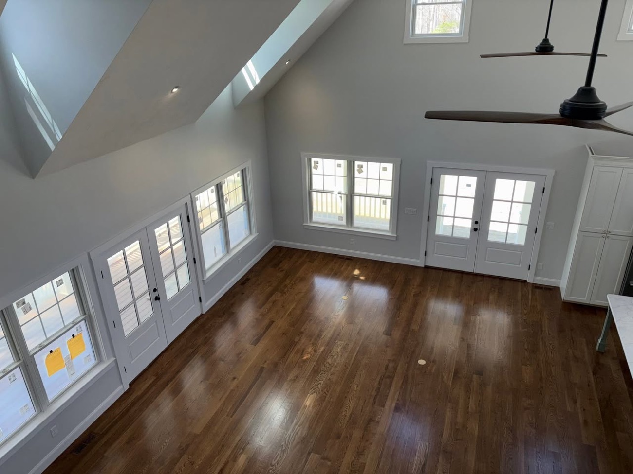 Open living space with refinished red oak hardwood floors